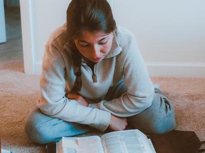 Allison Troyer reads from the book of Esther. (Photo by Chariti Mealing, CIU Student Photographer) 